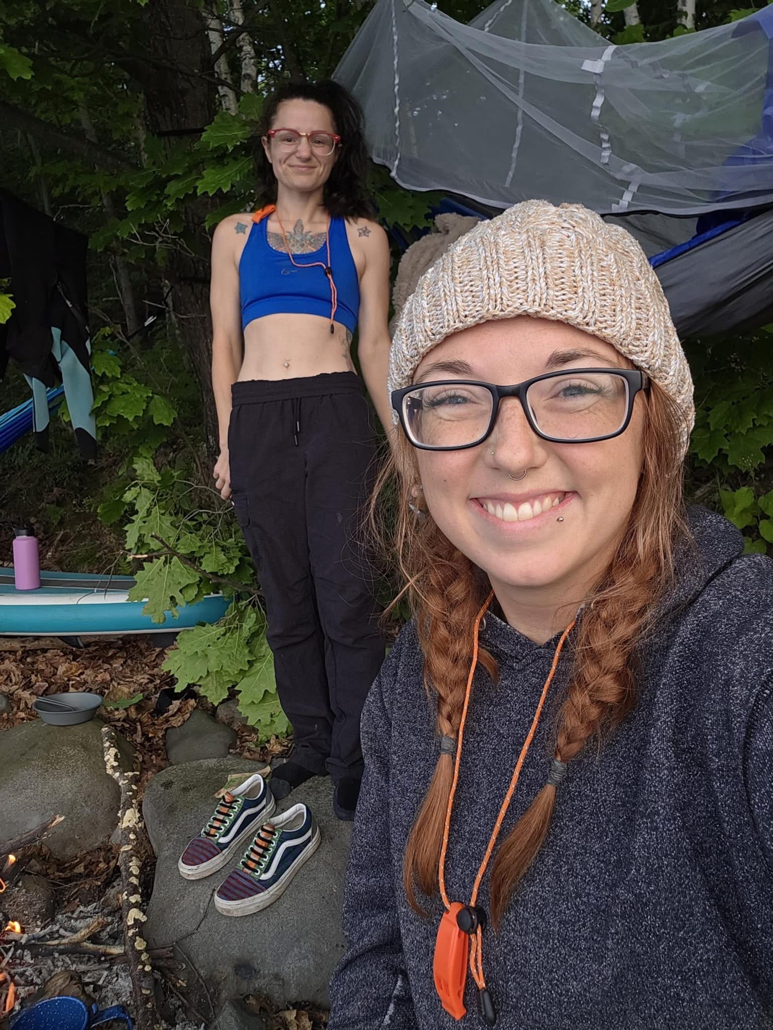 Ashley and Brittany smiling together at their island campsite
